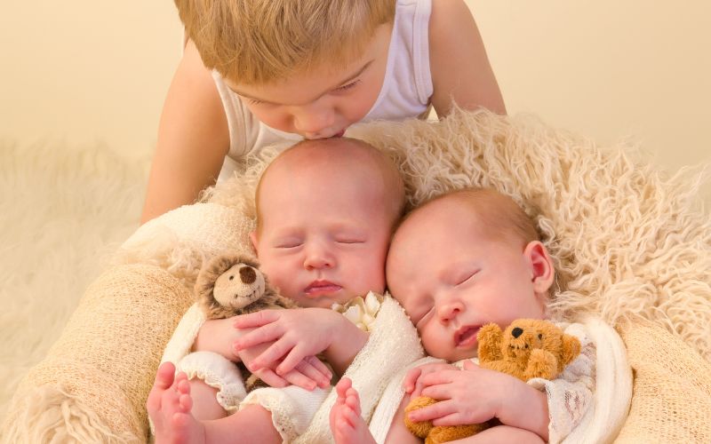 Job interview with newborn twins working with newborn twins and a toddler